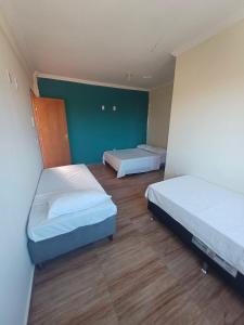 Postel nebo postele na pokoji v ubytování Pousada Estrela Mares Suíte 308