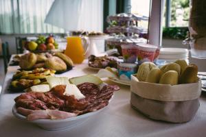 a table with a bunch of different types of food at Hotel Royal in Giulianova
