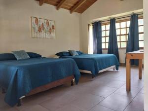Monterico- Casa en la playa Pitas2客房内的一张或多张床位