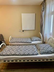 Postel nebo postele na pokoji v ubytování Kael Apartment