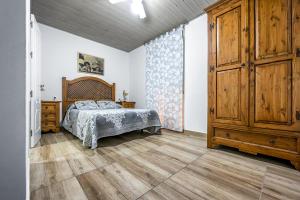 Cama o camas de una habitación en APARTAMENTO EN OLVERA CON GARAJE