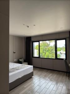 Postel nebo postele na pokoji v ubytování Taufusi Hotel