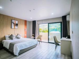 Postel nebo postele na pokoji v ubytování Taufusi Hotel