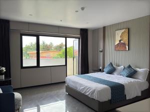 Postel nebo postele na pokoji v ubytování Taufusi Hotel