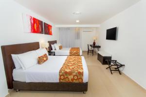 Postel nebo postele na pokoji v ubytování Hotel Playa Club