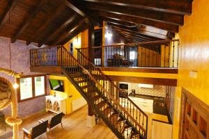 an overhead view of a spiral staircase in a building at Casa Rural El Ribero II in Montiano de Mena