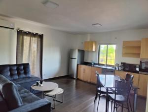 a living room with a couch and a table and a kitchen at Casa Catalina Obligado in Obligado