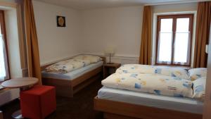 Postel nebo postele na pokoji v ubytování Hotel Stätzerhorn