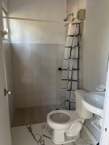a bathroom with a toilet and a sink at Casa Aurora in Pisté +25 photos