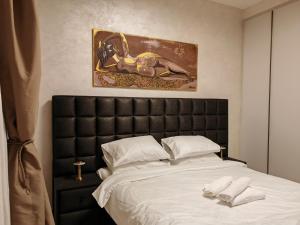 Giường trong phòng chung tại Belgrade Waterfront BW Libera Luxury Apartment with Balcony and Garage