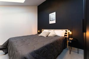 Postel nebo postele na pokoji v ubytování Residence La Corte - Mansarda 7