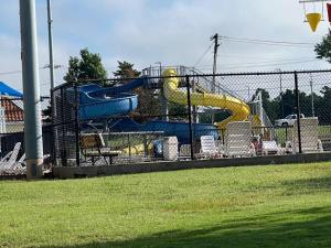 a playground with a slide in a park at Comfort Home WiFi n Hottub in Midwest City