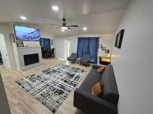 a living room with a couch and a fireplace at Comfort Home WiFi n Hottub in Midwest City