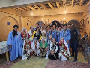 a group of people posing for a picture in a church at Amerdoul in Icht