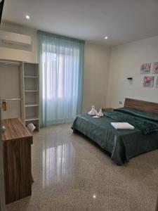 Postel nebo postele na pokoji v ubytování B&B Esterina