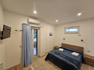 Postel nebo postele na pokoji v ubytování B&B Esterina