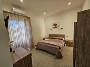 Postel nebo postele na pokoji v ubytování B&B Esterina
