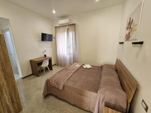 Postel nebo postele na pokoji v ubytování B&B Esterina
