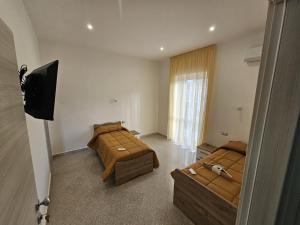 Postel nebo postele na pokoji v ubytování B&B Esterina