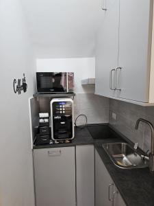 Kuchyň nebo kuchyňský kout v ubytování B&B Esterina