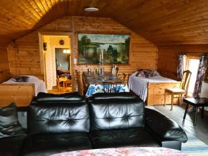 a living room with a couch and a table at 4 star holiday home in BÄCKEFORS in Bäckefors