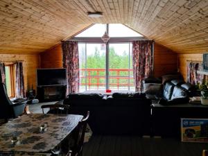 a living room with a couch and a table at 4 star holiday home in BÄCKEFORS in Bäckefors