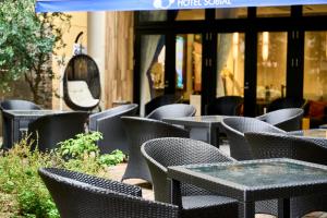 a row of tables and chairs in front of a store at Hotel Sobial Osaka Dome in Osaka