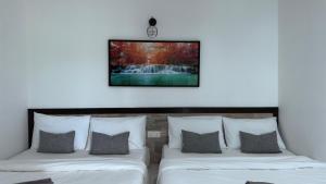 Postel nebo postele na pokoji v ubytování DVilla Guesthouse Langkawi