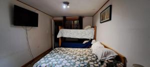 Postel nebo postele na pokoji v ubytování Hotel Cordillera Cabildo