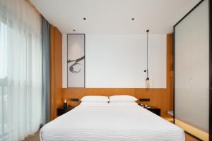 Postel nebo postele na pokoji v ubytování Fairfield by Marriott Zhuhai Xiangzhou