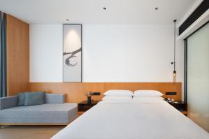Postel nebo postele na pokoji v ubytování Fairfield by Marriott Zhuhai Xiangzhou + 37 fotografií