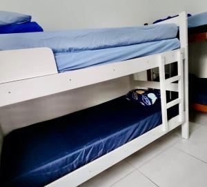 Ένα ή περισσότερα κρεβάτια σε δωμάτιο στο Aquamarine House