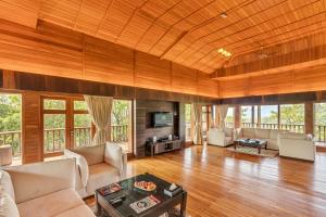 a living room with a couch and a table at Aamby Valley City in Lonavala