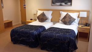 A bed or beds in a room at Springfields 