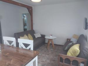 a living room with a couch and a table at Doña Lia in El Calafate