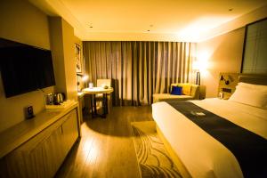 Ένα ή περισσότερα κρεβάτια σε δωμάτιο στο Echarm Hotel - Jingmen Yintai City Jingchu Institute of Technology