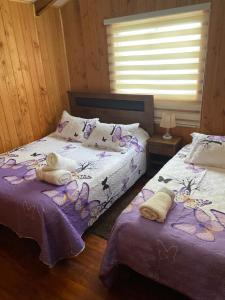 Postel nebo postele na pokoji v ubytování Cabaña jazmin + 2 fotografie