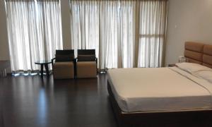 Malabar Residency客房内的一张或多张床位