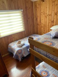 Postel nebo postele na pokoji v ubytování Cabaña jazmin