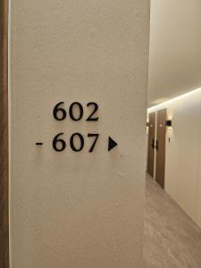 a clock on the wall of a hallway at Hwagok August in Seoul