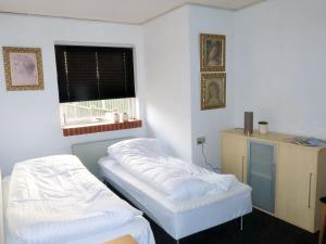 Postel nebo postele na pokoji v ubytování Centrum Sleepover