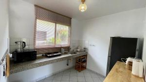 Kuchyň nebo kuchyňský kout v ubytování The Rai Resort