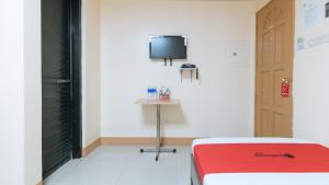 TV o dispositivi per l'intrattenimento presso RedDoorz at Isabelita Hotel Tuguegarao City
