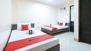 Letto o letti in una camera di RedDoorz at Isabelita Hotel Tuguegarao City