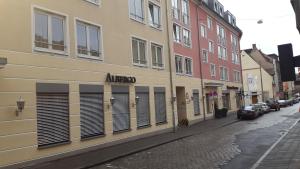 a building with an aerg sign on the side of a street at Hostel Nuremberg in Nuremberg
