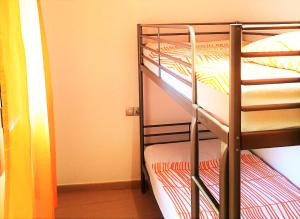 Postel nebo postele na pokoji v ubytování Lloret Beach Apartments