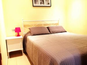 Postel nebo postele na pokoji v ubytování Lloret Beach Apartments