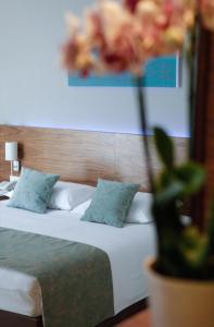 Postel nebo postele na pokoji v ubytování Hotel Korsal
