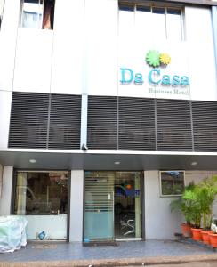 a store front of a building with a sign on it at Da Casa Business Hotel in Pune +10 photos