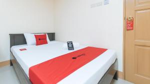Letto o letti in una camera di RedDoorz at Isabelita Hotel Tuguegarao City